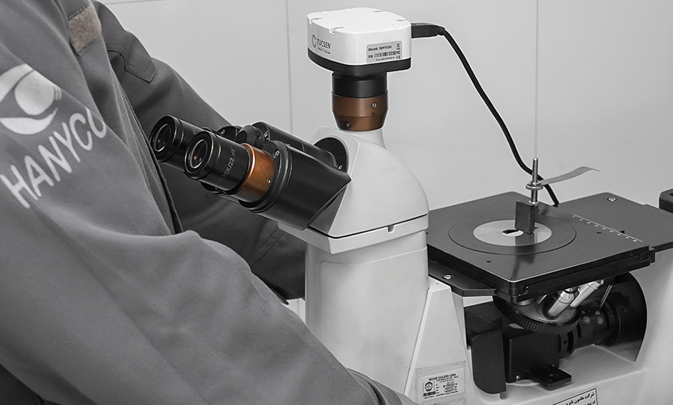 Man looking into a microscope